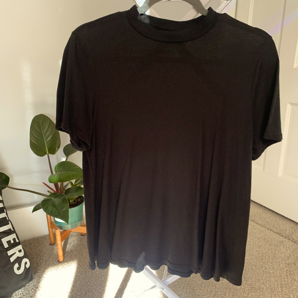 Butter soft black mock turtleneck flowing tee shirt from Anthropologie